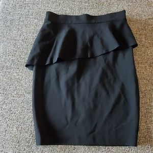 Black stretch peplum skirt